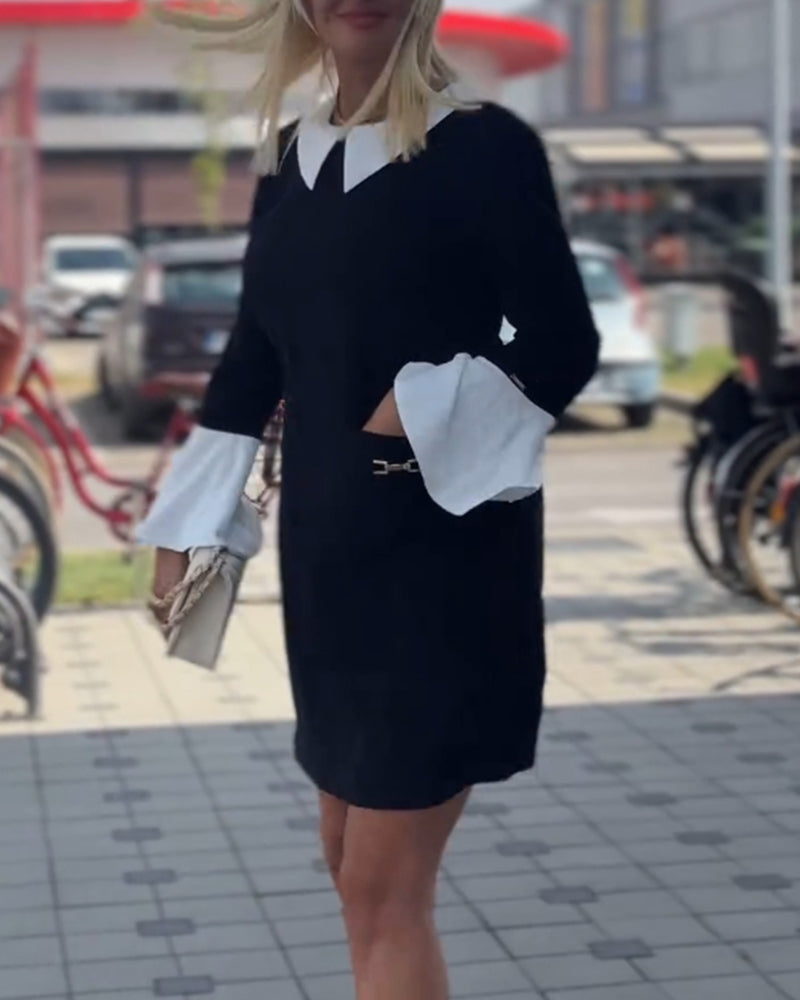 Elegant kjole med klokkeærmer og falsk lagdeling