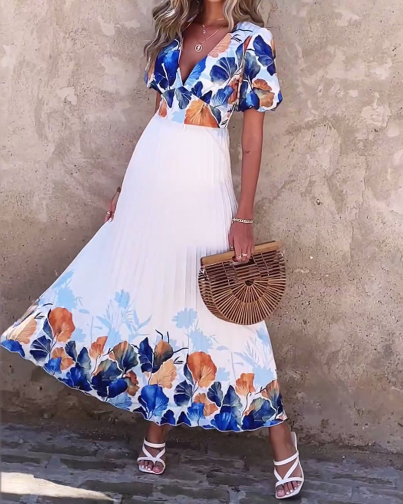 Kjole i dyb V-stil med bobleærmer