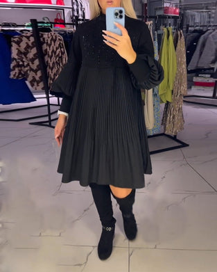 Kjole med svaj og ballonærmer