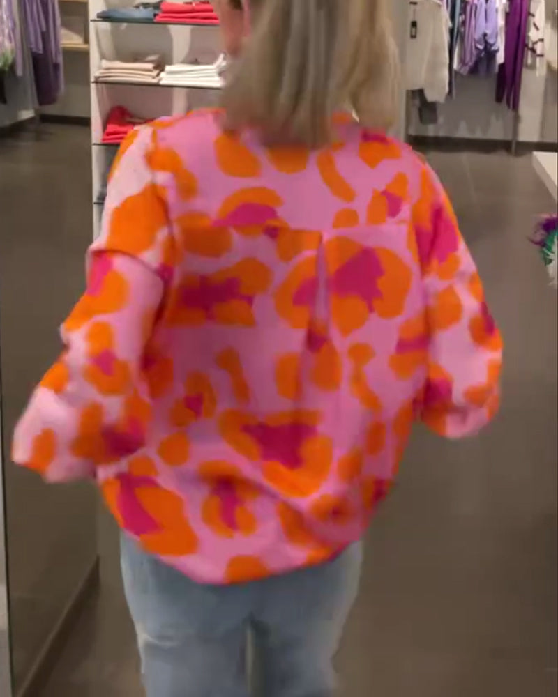 Afslappet top med V-udskæring og lanterneærmer