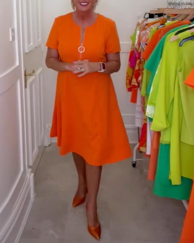 Stilfuld kortærmet orange kjole med lynlås