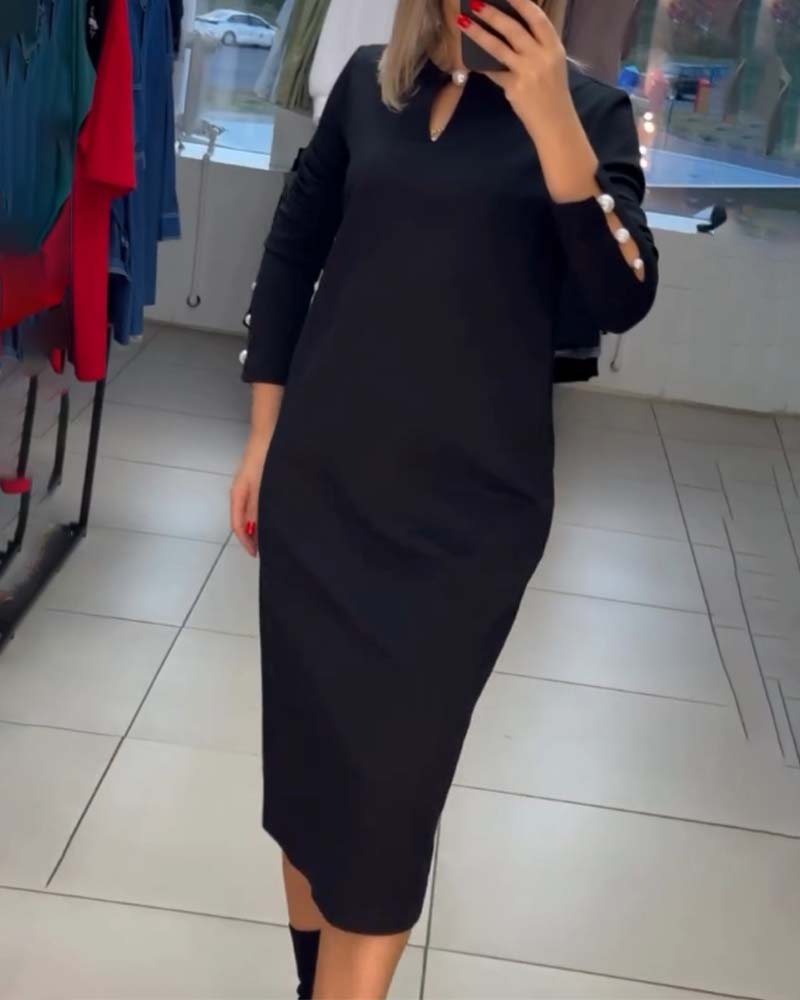 Elegant kjole med perleknapper