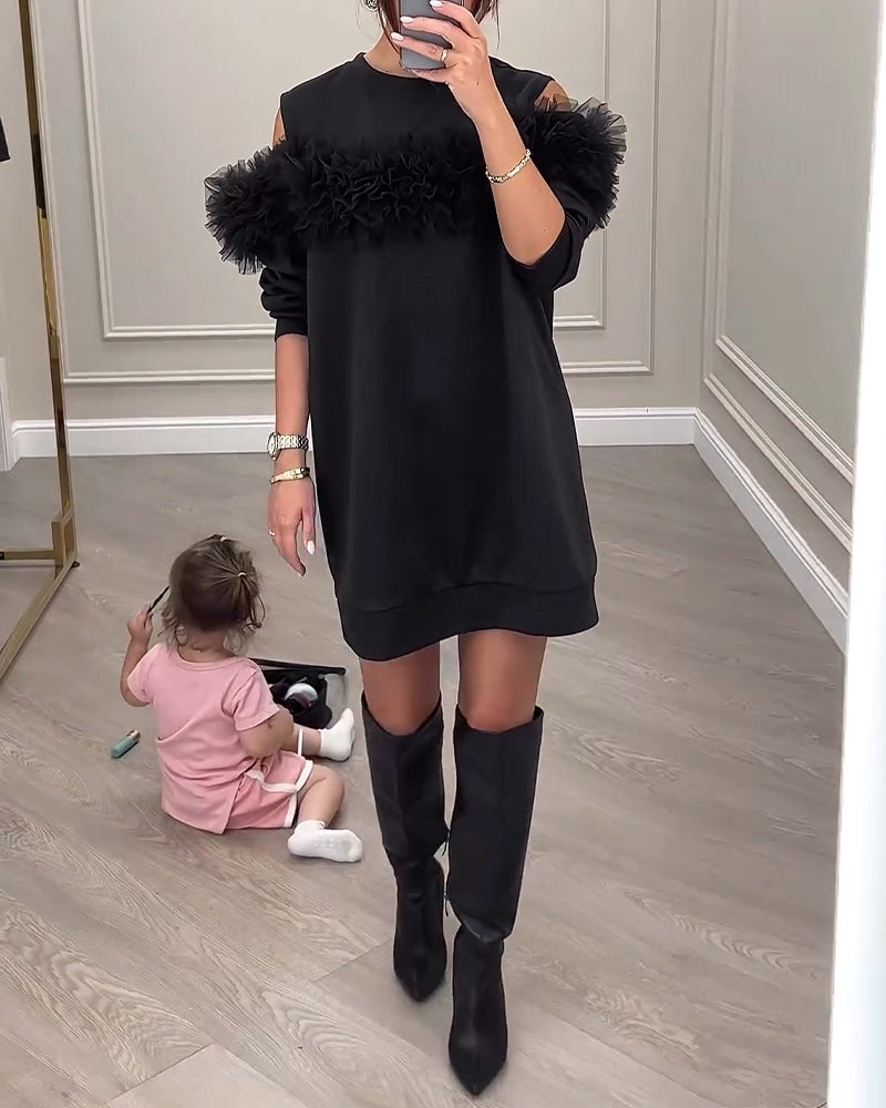 Sort kjole med pelskrave