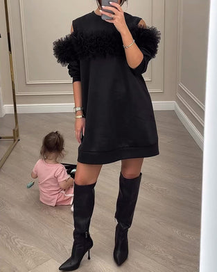 Sort kjole med pelskrave