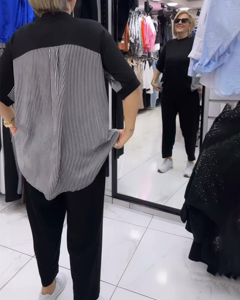 Afslappet sort bluse med nålestribet ryg