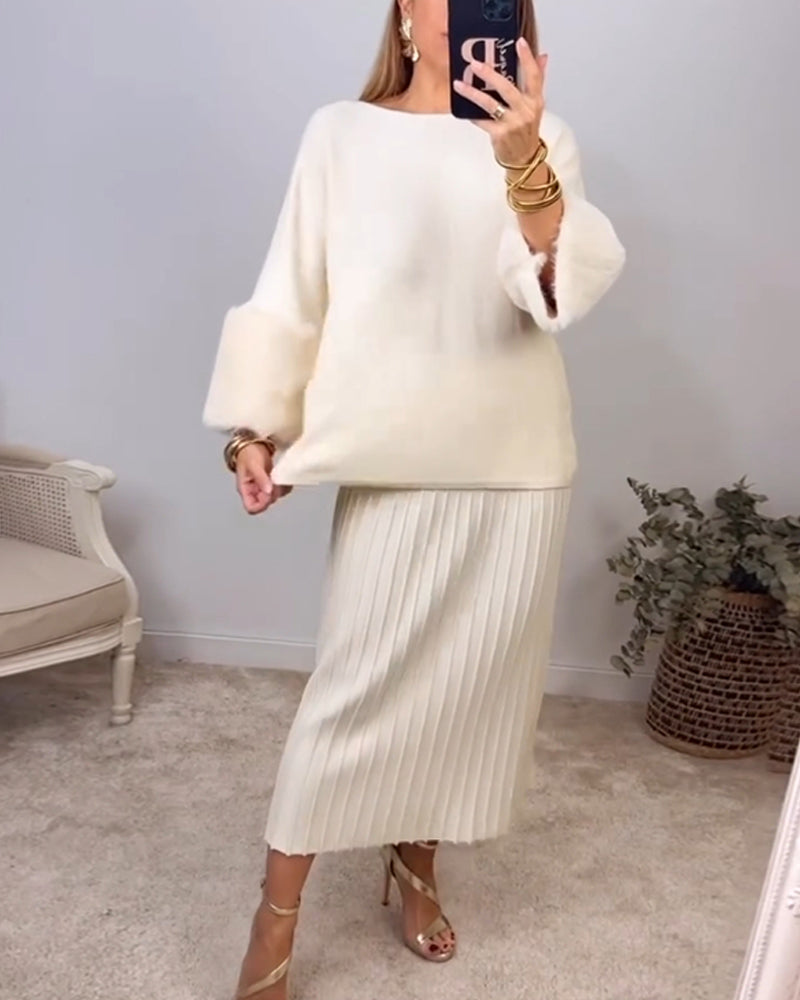 Elegant hvid sweater med plysmanchetter