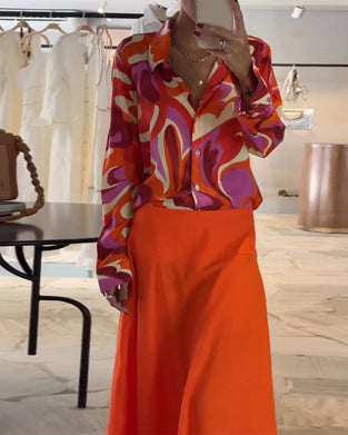 Farverig trykt bluse med revers og knapper