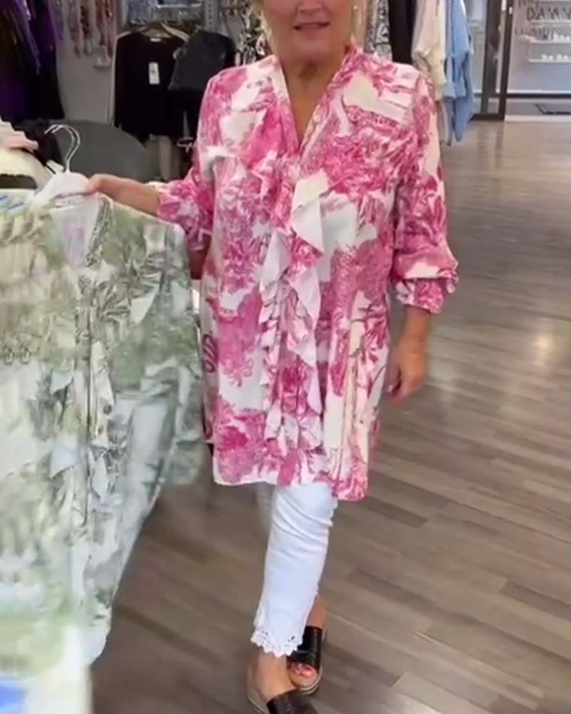 Afslappet bluse med flæser og print