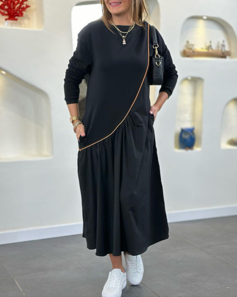 Skiftskjole med lomme og lange ærmer