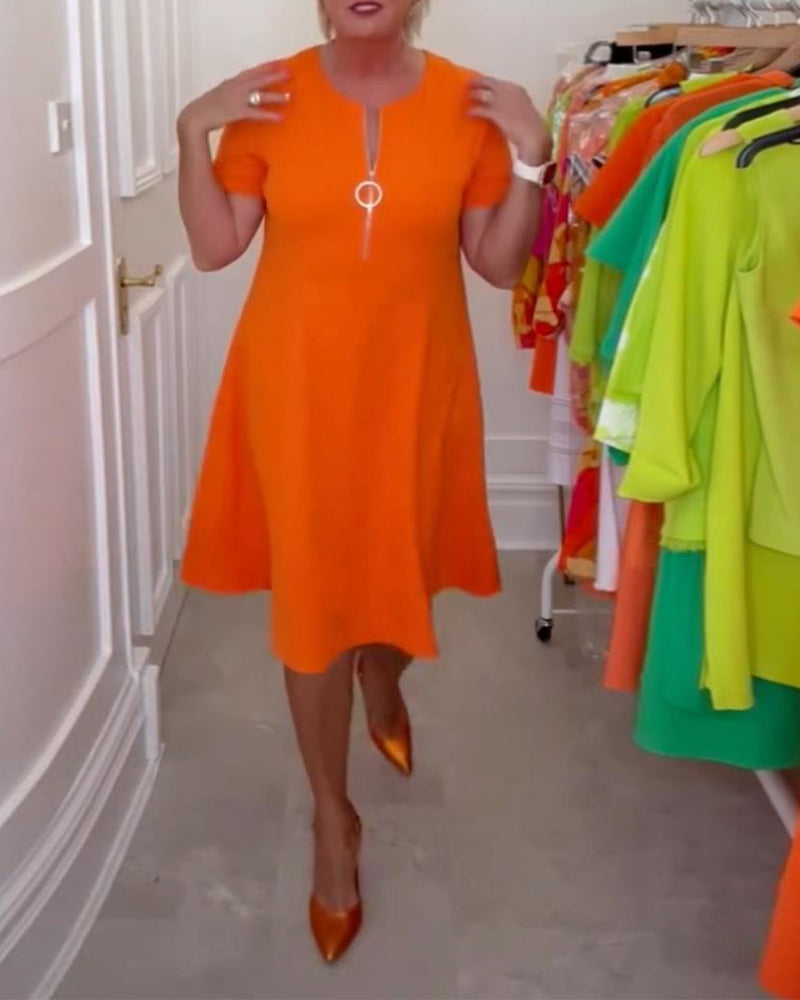 Stilfuld kortærmet orange kjole med lynlås