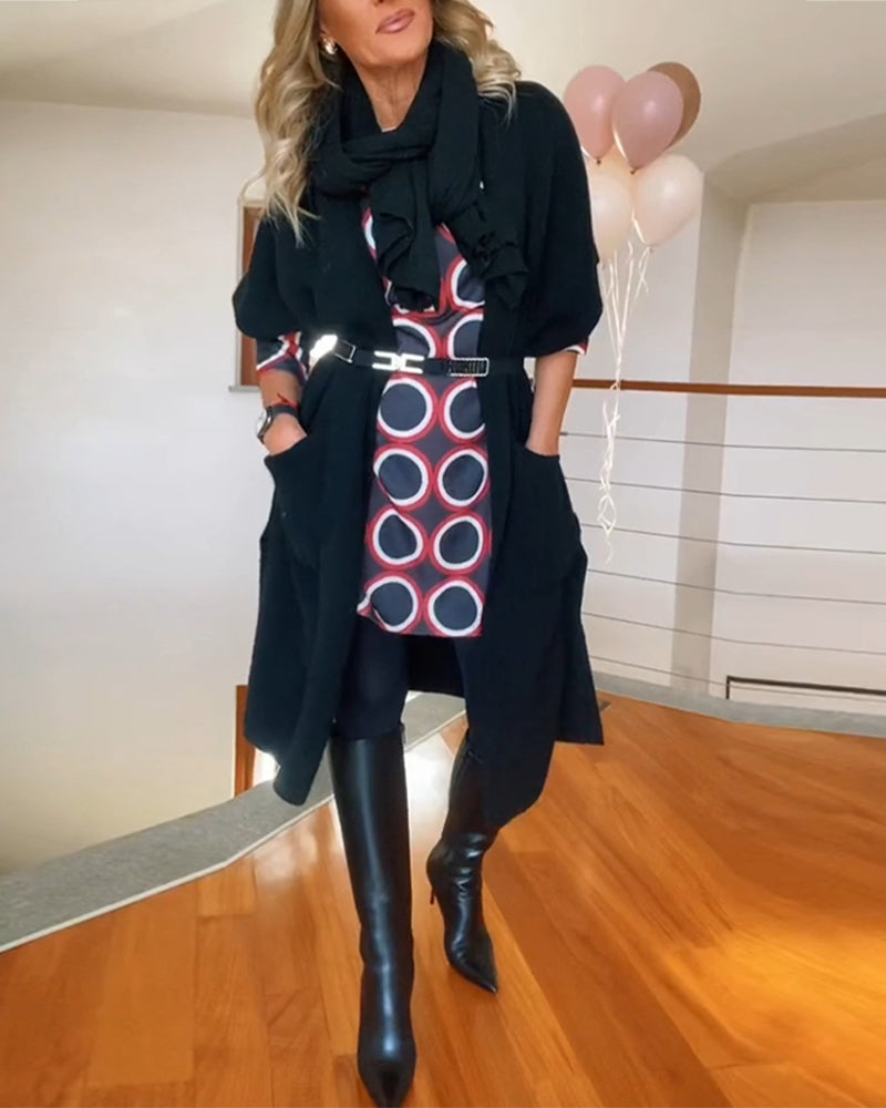 Lang sort cardigan med lommer og halve ærmer