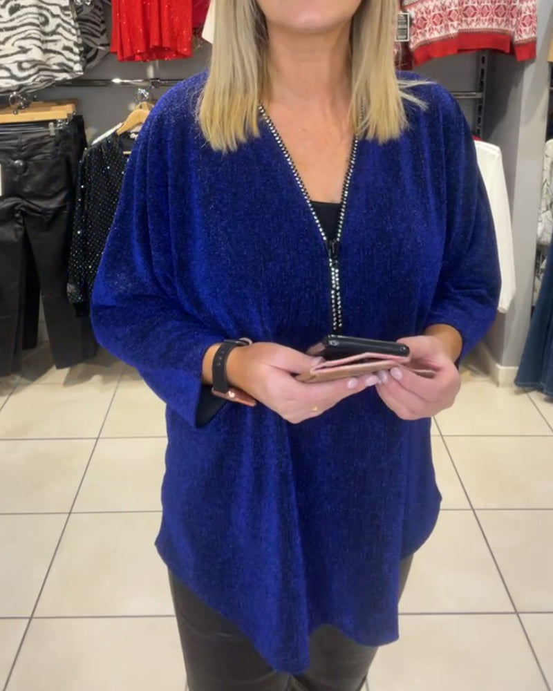 Afslappet top med lange ærmer og lynlås