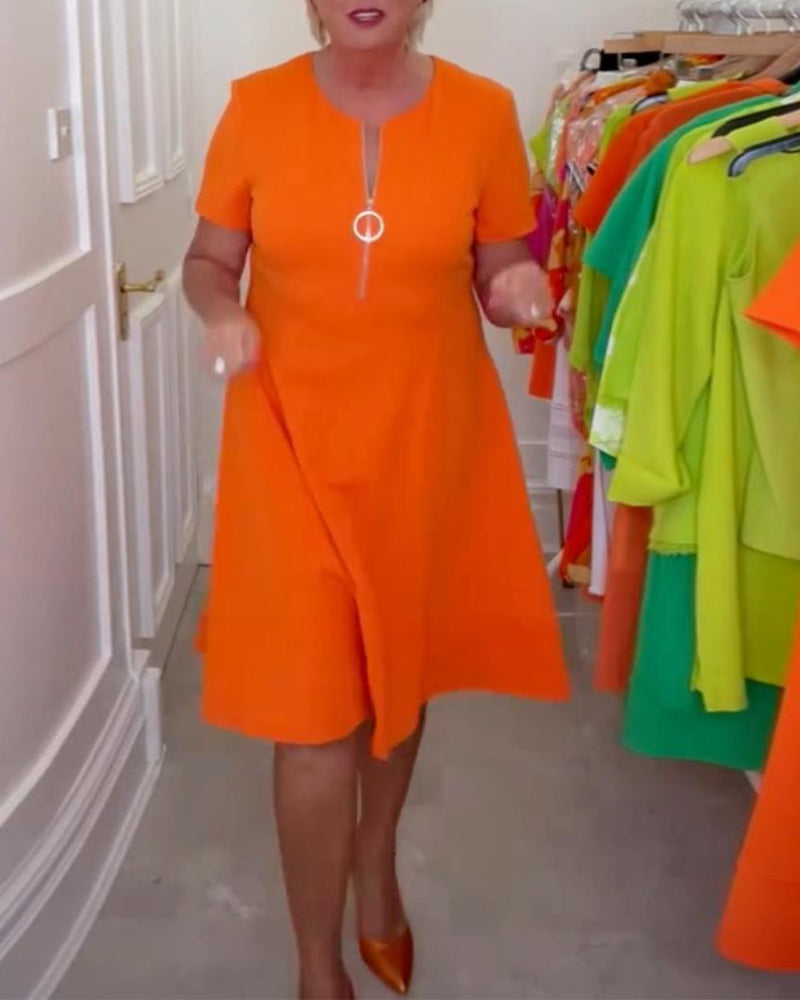 Stilfuld kortærmet orange kjole med lynlås