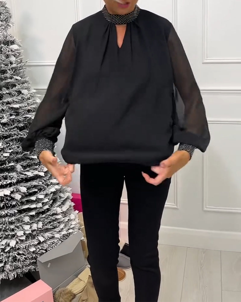 Stilfuld ensfarvet bluse med ståkrave