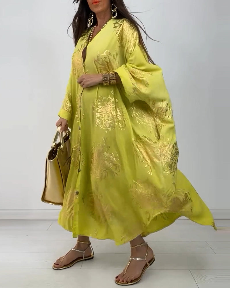 Langærmet oversized kjole med knapper og print