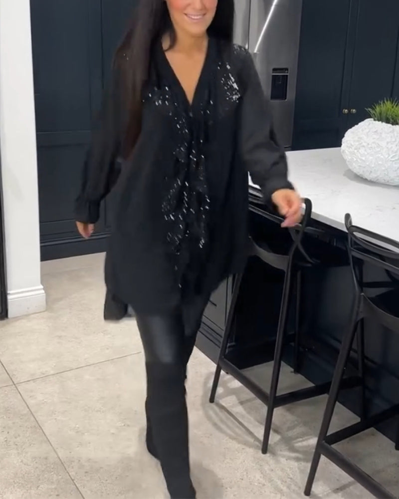 Lang bluse med elegante flæser