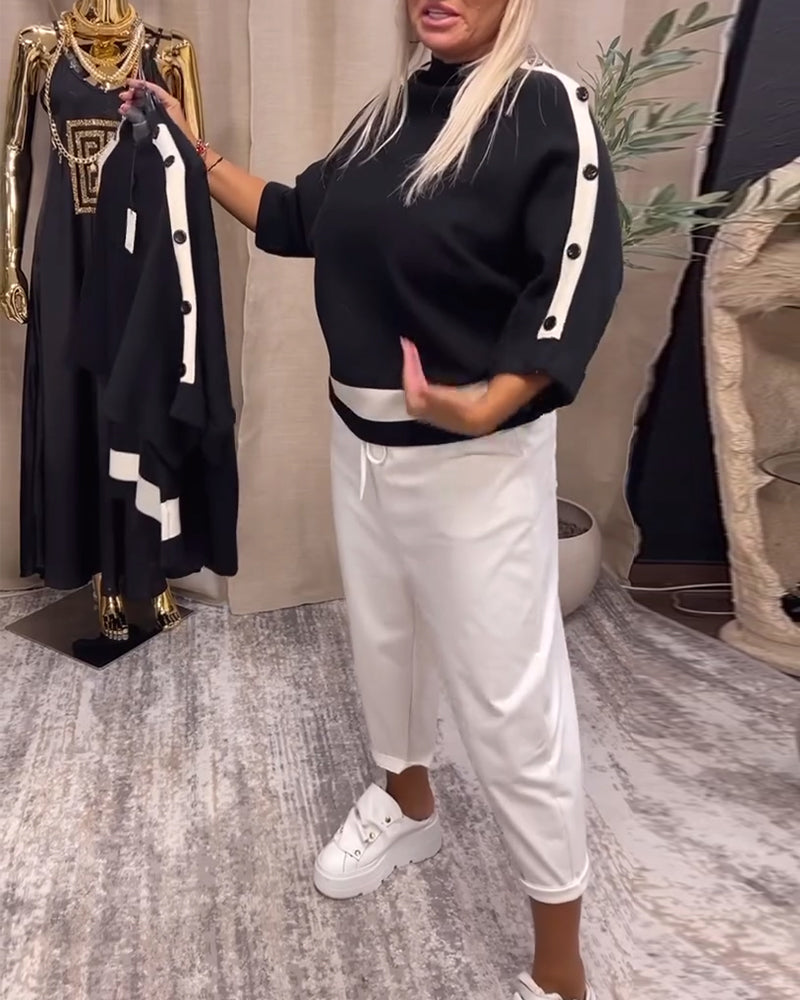 Sort sweater med hvid stribekant