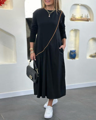 Skiftskjole med lomme og lange ærmer