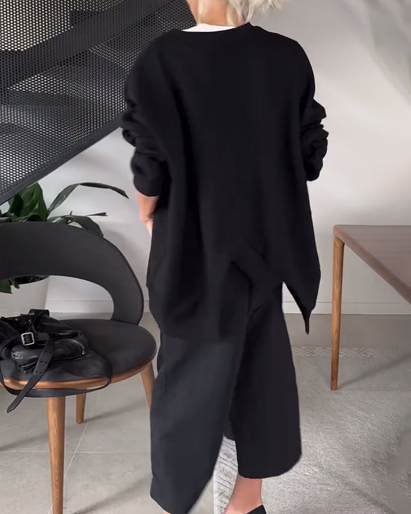 Sort sweater i løs pasform med slids