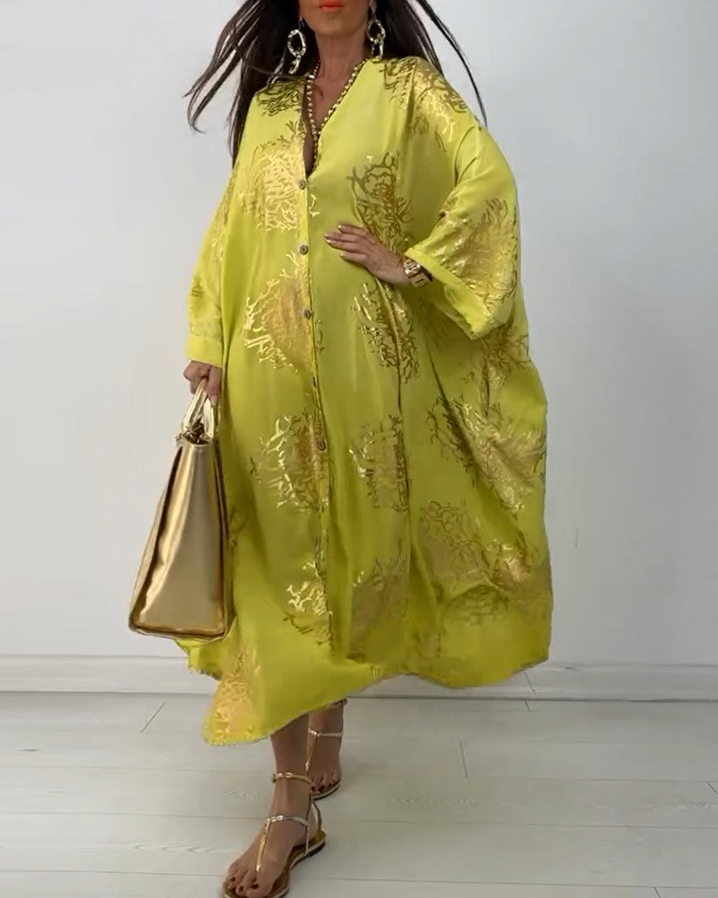 Langærmet oversized kjole med knapper og print