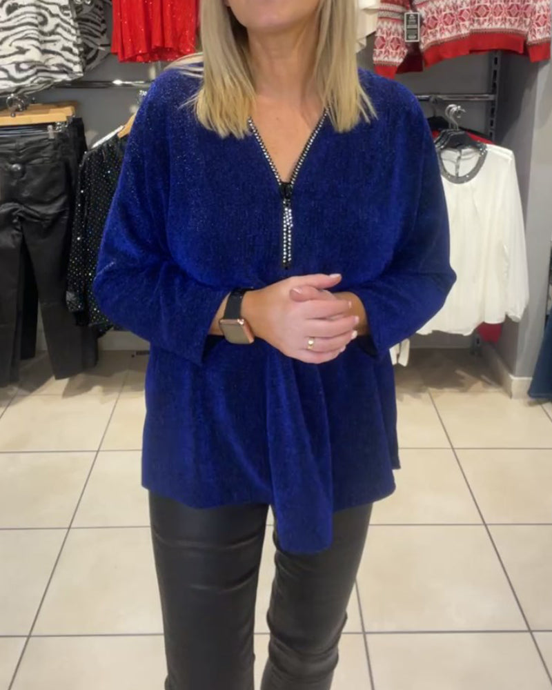 Afslappet top med lange ærmer og lynlås