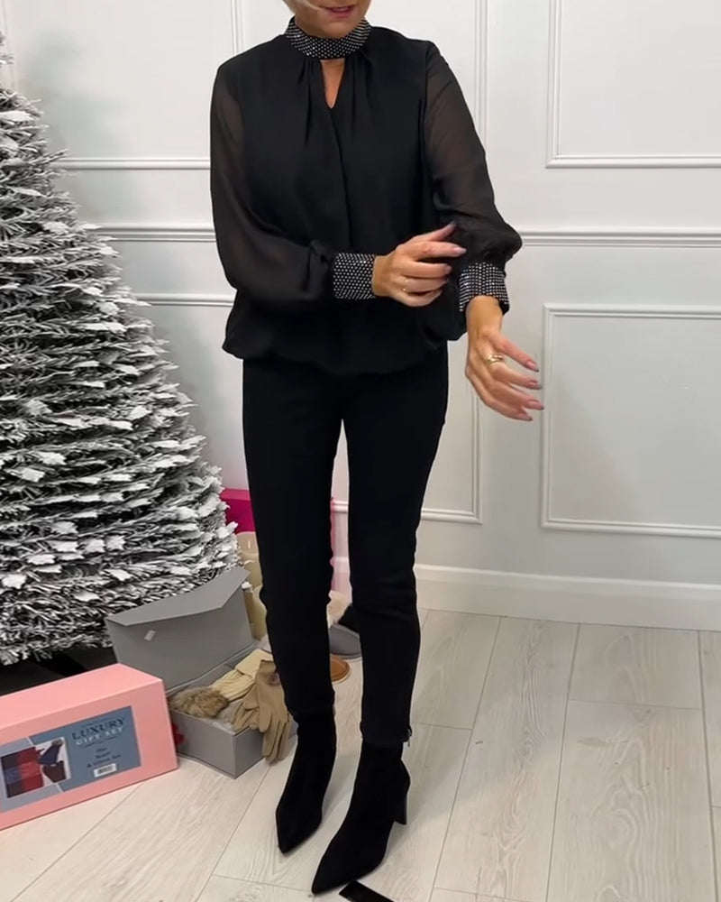 Stilfuld ensfarvet bluse med ståkrave