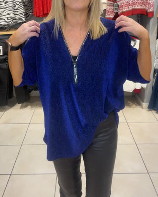 Afslappet top med lange ærmer og lynlås