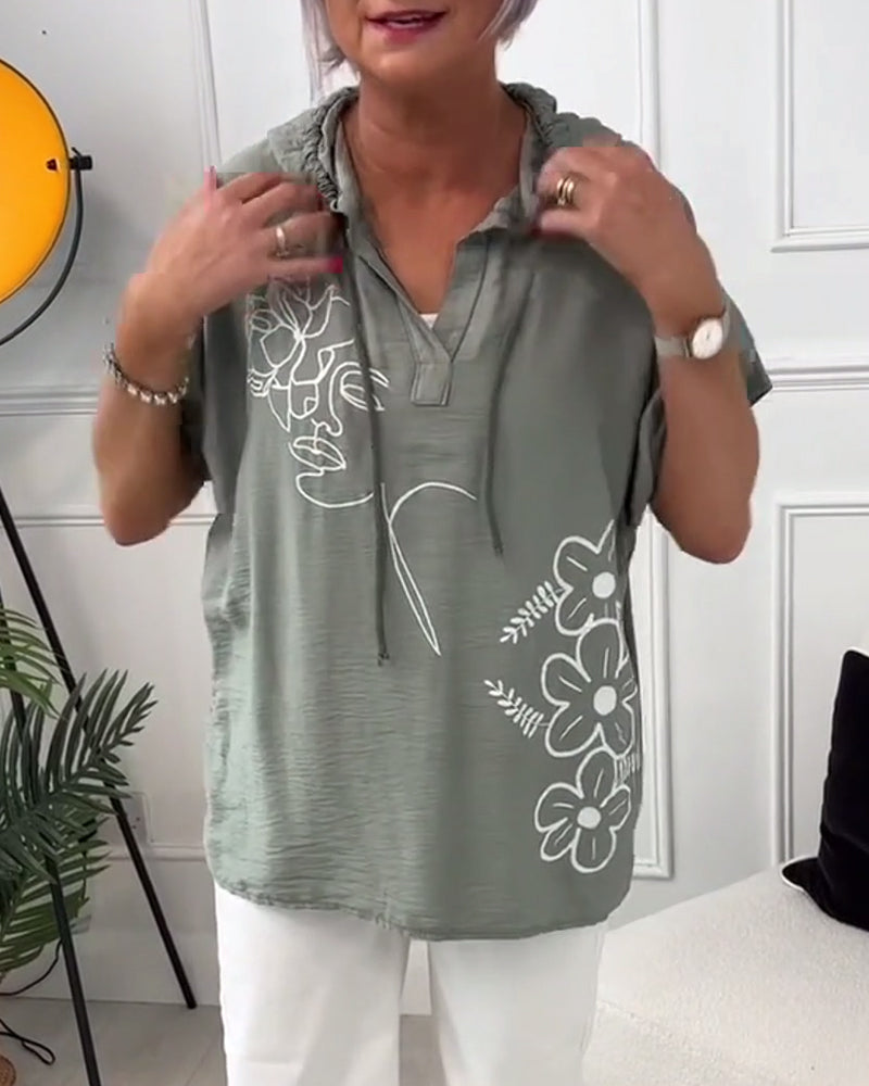 Afslappet hættetrøje med korte ærmer og blomsterprint