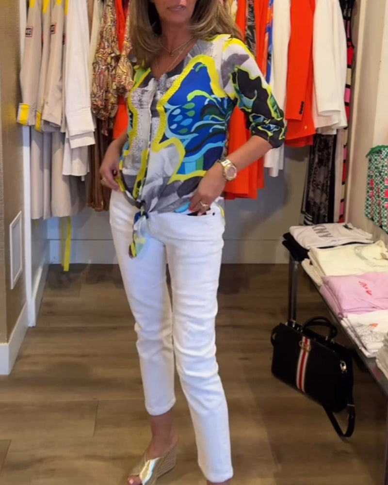 Bluse med V-udskæring og gule accenter